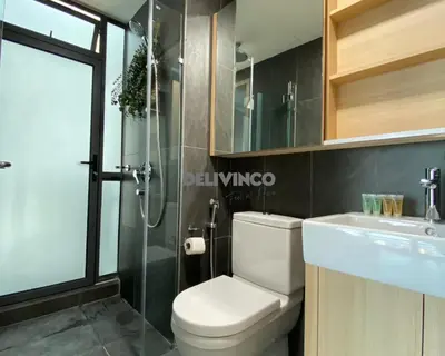 a bathroom with a toilet and a sink and a shower at The Luxe - 3 pax - KLCC View - Balcony at 27 floor in Kuala Lumpur