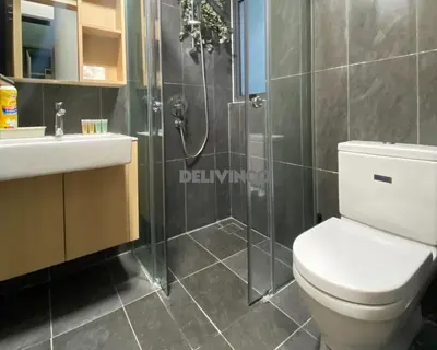 a bathroom with a shower and a toilet and a sink at The Luxe 2 pax Studio at KL - Microwave - Washer in Kuala Lumpur