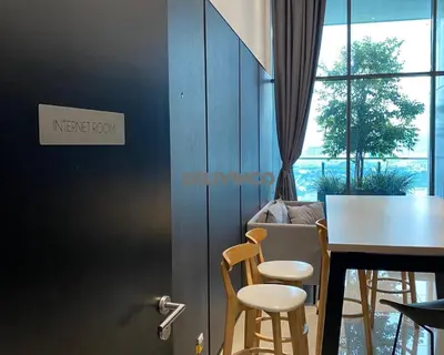 a dining room with a table and chairs and a window at The Luxe - KLCC View - 3 pax Balcony at 41 floor in Kuala Lumpur