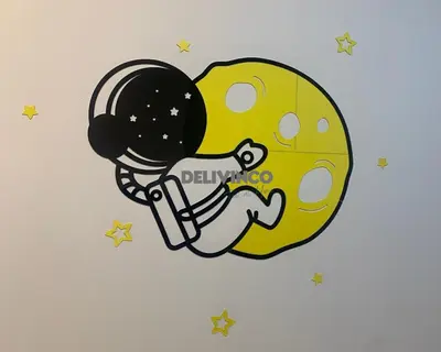 a cartoon illustration of an astronaut in the stars at Stylish AeroSpace Theme 1BR in KL City Center in Kuala Lumpur