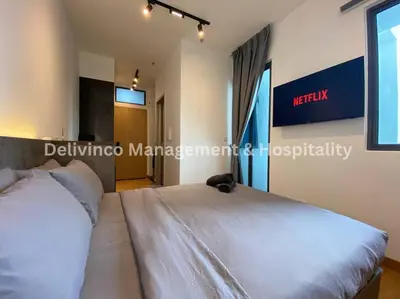 a bedroom with a large white bed in a room at The Luxe Studio - 2 pax - KL - Microwave - Fridge in Kuala Lumpur