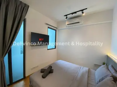 a bedroom with a white bed and a window at The Luxe Studio - 2 pax - KL - Microwave - Fridge in Kuala Lumpur