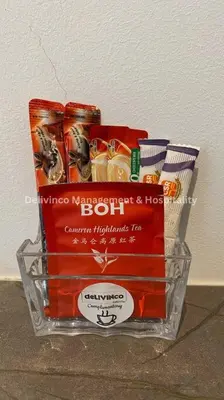 a basket of food and drinks on a table at The Luxe Studio - 2 pax - KL - Microwave - Fridge in Kuala Lumpur