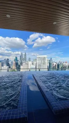 a swimming pool with a view of a city at The Luxe Studio - 2 pax - KL - Microwave - Fridge in Kuala Lumpur