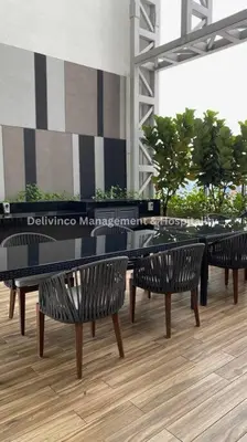 a table and benches with a piano in a building at The Luxe Studio - 2 pax - KL - Microwave - Fridge in Kuala Lumpur