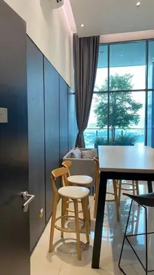 a dining room with a table and chairs and a window at The Luxe Studio - 2 pax - KL - Microwave - Fridge in Kuala Lumpur