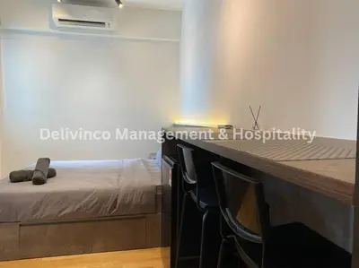 a bedroom with a bed and chairs in a room at The Luxe Studio - 2 pax - KL - Microwave - Fridge in Kuala Lumpur