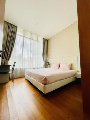 a bedroom with a large bed and a window at Vortex suites klcc by Yashrib in Kuala Lumpur