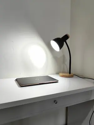 a laptop sitting on a white desk with a lamp at Setapak Central Mall KL - Zetapark Garden Suites in Kuala Lumpur