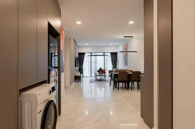 a kitchen and living room with a dining room at Eaton Residences by Sutera at KLCC in Kuala Lumpur