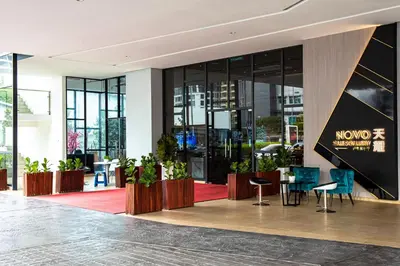a lobby of a building with a table and chairs at Stay @ NOVO Ampang in Kuala Lumpur