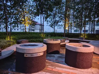 a group of stone barrels sitting in a park at M Centura Sentul 2 bedrooms with pool in Kuala Lumpur