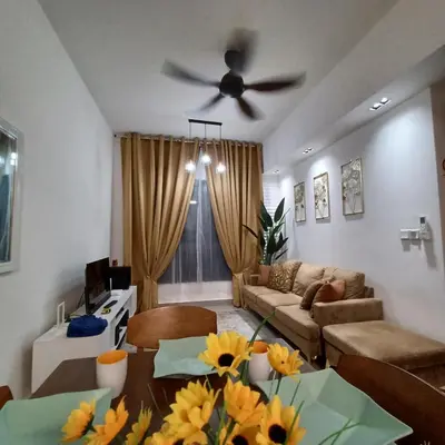 a living room with a couch and a ceiling fan at M Centura Sentul 2 bedrooms with pool in Kuala Lumpur