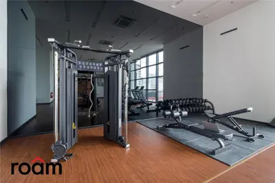a gym with several treadmills and cardio machines at Chambers Residence, Sunway Putra Mall in Kuala Lumpur