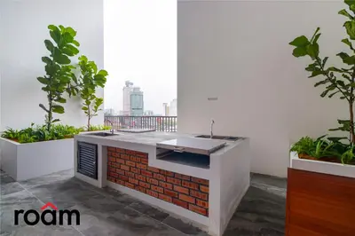 a kitchen with a sink in a room with plants at Chambers Residence, Sunway Putra Mall in Kuala Lumpur