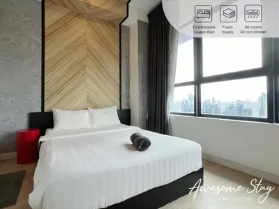 a bedroom with a large white bed with a large window at Arte plus by sweet home 2BR in Kuala Lumpur