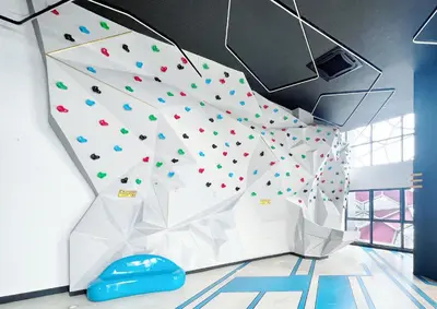 a climbing wall in a room with a rock wall at Arte plus by sweet home 2BR in Kuala Lumpur