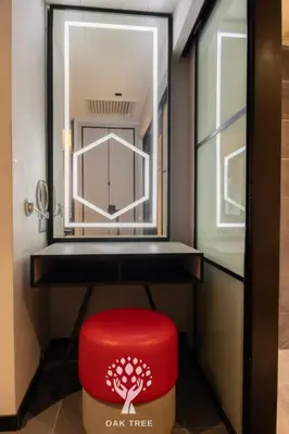 a red stool in a dressing room with a mirror at Red M101 by Oak Tree in Kuala Lumpur