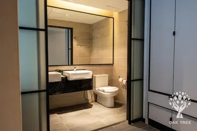 a bathroom with a sink and a toilet and a mirror at Red M101 by Oak Tree in Kuala Lumpur