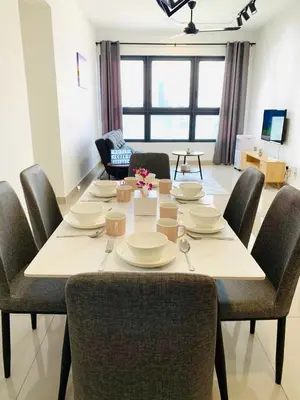 a dining room table with chairs and a dining room at 4BR M Vertica near Sunway Velocity Cheras IKEA MRT TRX KLCC Pavilion in Kuala Lumpur