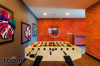 a room with a pool table in the middle of it at Datum Jelatek Sky Residence Kuala Lumpur, Roam in Kuala Lumpur