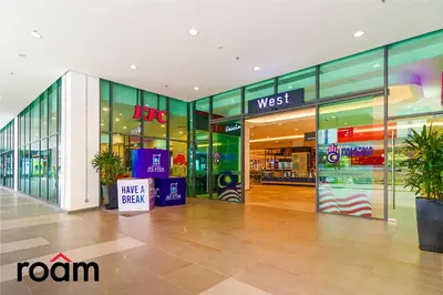a shopping mall with glass doors and a store at Datum Jelatek Sky Residence Kuala Lumpur, Roam in Kuala Lumpur