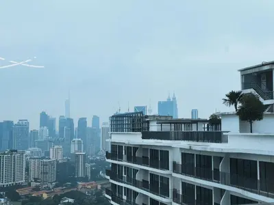 a building with a city in the background at Datum Jelatek, Sky Ring in Kuala Lumpur