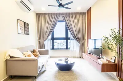 a living room with a couch and a ceiling fan at M Vertica KL by Airhost in Kuala Lumpur