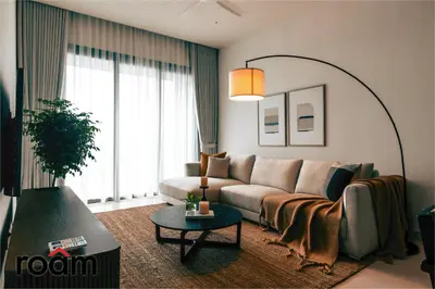 a living room with a couch and a table at ViiA Residences Kuala Lumpur in Kuala Lumpur