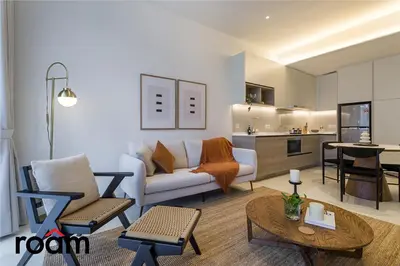 a living room with a couch and a table at ViiA Residences Kuala Lumpur in Kuala Lumpur