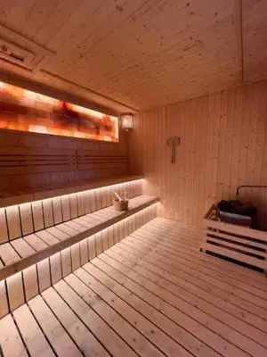 an empty sauna with a bench in the middle at Maxhome at Axon Bukit Bintang in Kuala Lumpur
