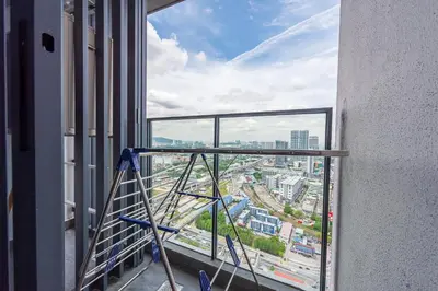 a view of a city from a window in a building at Continew 1BR High TRX Mall King Bed 100Mbps Wi-Fi in Kuala Lumpur
