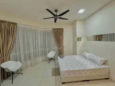 a bedroom with a bed and a ceiling fan at HaBiBi hOmE Klcc in Kuala Lumpur
