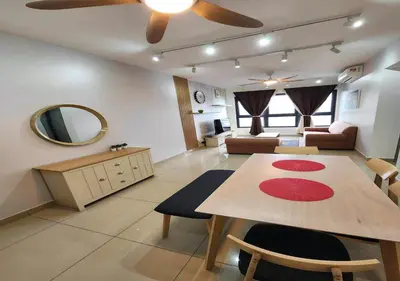a living room with a dining table and a living room with a couch at 5 mins to IKEA Mytown M Vertica Hanan Residence in Kuala Lumpur