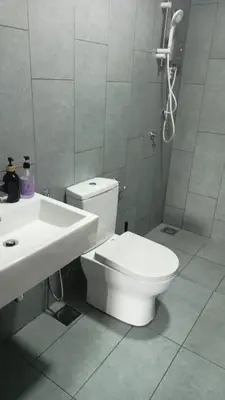 a bathroom with a toilet and a sink and a shower at 5 mins to IKEA Mytown M Vertica Hanan Residence in Kuala Lumpur