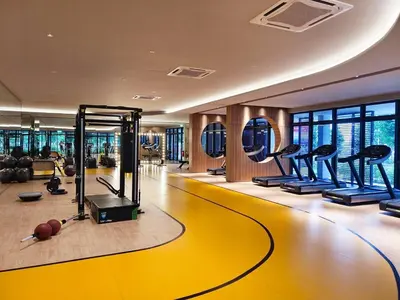 a gym with treadmills and exercise equipment in a building at 5 mins to IKEA Mytown M Vertica Hanan Residence in Kuala Lumpur