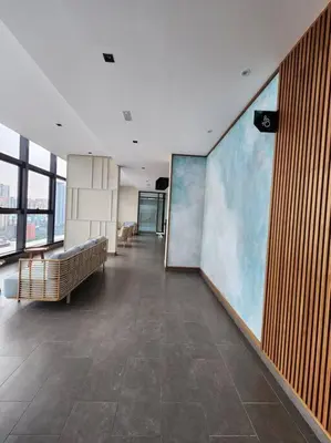 a hallway in a building with a large painting on the wall at The Gallery @ Pano Jln Ipoh -MRT. S/Check-In. Free Parking in Kuala Lumpur