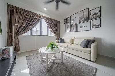 a living room with a couch and a table at Peaceful 2-bedroom for 6 Pax - Chan Sow Lin in Kuala Lumpur