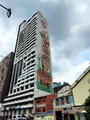a tall building with a mural on the side of it at The Roma at Dang Wangi Kuala Lumpur in Kuala Lumpur
