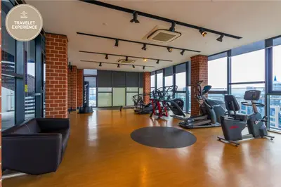 a gym with treadmills and cardio equipment in a building at Ceylonz Suite KLCC, Travelet in Kuala Lumpur