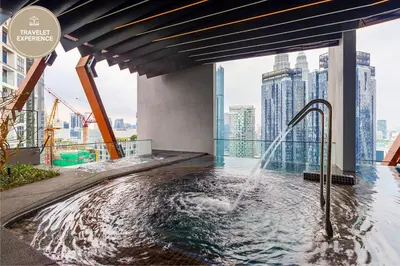 a hot tub on the floor of a skyscraper at Scarletz Suites KLCC, Travelet in Kuala Lumpur