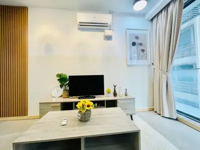 a living room with a table and a television at #125 Bintang Fairlane KLCC - Lot 10 - Pavilion - Fahrenheit for 1-5px in Kuala Lumpur