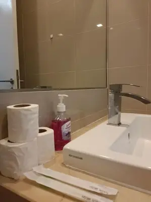 a bathroom counter with a sink and a mirror at RM2a18 Bukit Bintang Balcony Studio in Kuala Lumpur