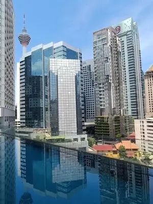 a city with tall buildings and a pool of water at RM2a18 Bukit Bintang Balcony Studio in Kuala Lumpur