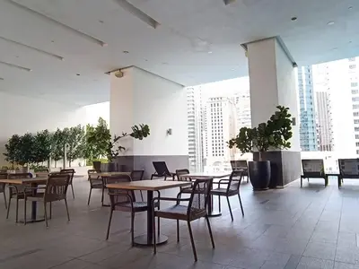 a dining room with tables and chairs in a building at RM201 Bukit Bintang 2 Bedroom Balcony CIty View in Kuala Lumpur