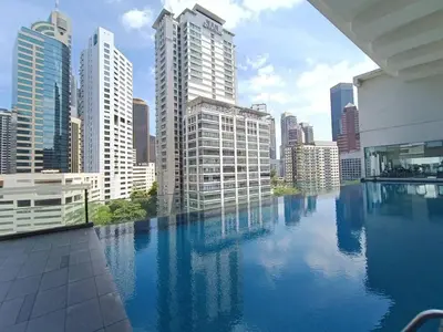a swimming pool in a city with tall buildings at RM203 Bukit Bintang Balcony Studio Infinity Pool in Kuala Lumpur