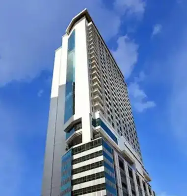 a tall building with a blue sky in the background at RM231 2Bedroom Bukit Bintang Balcony KL City View in Kuala Lumpur