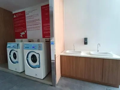 a bathroom with a washing machine and a sink at RM231 2Bedroom Bukit Bintang Balcony KL City View in Kuala Lumpur