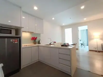 a kitchen with white cabinets and a counter top at RM231 2Bedroom Bukit Bintang Balcony KL City View in Kuala Lumpur