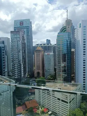 a view of a large city with tall buildings at RM238 Bukit Bintang Balcony Studio Infinty Pool in Kuala Lumpur